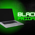 A imagem mostra um laptop aberto sobre um fundo de tijolos iluminado por uma luz verde. Ao lado do laptop, a frase "Black Friday" está em destaque com letras grandes e brilhantes, também em verde. A cena sugere um anúncio promocional, enfatizando ofertas especiais de tecnologia para a Black Friday.