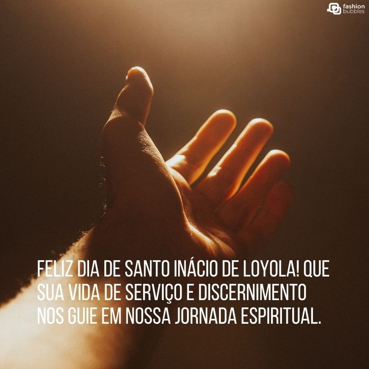 Foto de mão estendida sob luz amarela e frase " Feliz Dia de Santo Inácio de Loyola! Que sua vida de serviço e discernimento nos guie em nossa jornada espiritual."