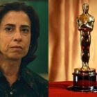 Fernanda Torres é branca, tem cabelos curtos e está caracterizada para o filme Ainda Estou Aqui. Ao lado, tem uma estatueta do Oscar.