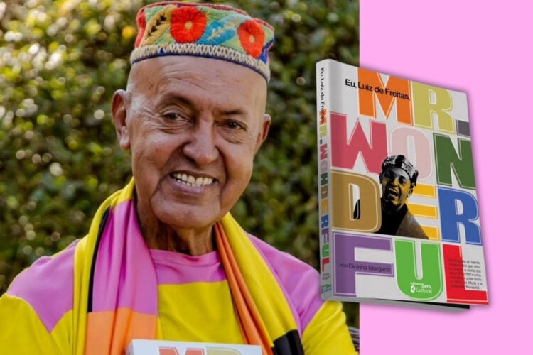 A imagem mostra um homem sorridente usando um chapéu colorido com bordados de flores. Ele veste uma camisa amarela com detalhes em rosa e laranja. Ao lado, há um livro intitulado "Mr. Wonderful" por Dininha Morgado. A capa do livro é vibrante, com letras grandes e coloridas, e uma foto em preto e branco do homem destacada. O fundo da imagem é dividido entre um cenário natural e uma cor rosa sólida.